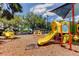 Fun playground featuring slides, climbing frames, and a covered area for community enjoyment at 3410 Briarwood Ln, Safety Harbor, FL 34695