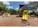 Colorful playground with slides, swings, and climbing equipment for recreational activities at 3410 Briarwood Ln, Safety Harbor, FL 34695