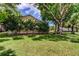 Spacious yard featuring mature trees and a well-maintained lawn enhancing the home's outdoor appeal at 3410 Briarwood Ln, Safety Harbor, FL 34695