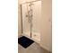 Bathroom with a large glass enclosed shower, modern fixtures, and a clean design at 3446 Suncoast Plains Dr, Odessa, FL 33556