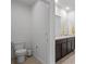 Modern bathroom with double vanity and well-lit mirror at 3446 Suncoast Plains Dr, Odessa, FL 33556