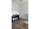 Spare bedroom featuring modern hardwood floors and ample natural light at 3446 Suncoast Plains Dr, Odessa, FL 33556