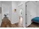 Bright hallway with hardwood floors leading to bedrooms and other living spaces at 3446 Suncoast Plains Dr, Odessa, FL 33556