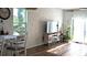 Inviting dining room with a waterfront view, and brick-look accent wall at 3446 Suncoast Plains Dr, Odessa, FL 33556