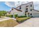 Charming townhouse with manicured landscaping and a private garage, bathed in natural light at 3455 Countryside Blvd # 101, Clearwater, FL 33761