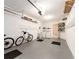 Spacious garage featuring storage racks, a washer/dryer, and ample room for parking at 3455 Countryside Blvd # 101, Clearwater, FL 33761