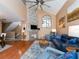 Inviting living room featuring a stone fireplace, hardwood floors, and comfortable seating at 3455 Countryside Blvd # 101, Clearwater, FL 33761