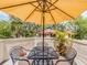 Outdoor patio with seating, providing a cozy space for relaxation and enjoying the natural surroundings at 3455 Countryside Blvd # 101, Clearwater, FL 33761