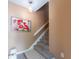 Cozy staircase with neutral tones, plush carpet, and a decorative light fixture, creating a welcoming ambiance at 3455 Countryside Blvd # 101, Clearwater, FL 33761