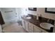 Bathroom featuring dual sinks with counter space, toilet, and tub at 3680 19Th S Ave, St Petersburg, FL 33711