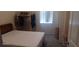 Cozy bedroom with a comfortable bed, natural light, and ample closet space at 3680 19Th S Ave, St Petersburg, FL 33711