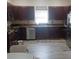 Well-equipped kitchen with stainless steel appliances, granite countertops, and rich wood cabinetry at 3680 19Th S Ave, St Petersburg, FL 33711
