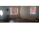 Bright and airy living room with wood-look floors and large windows providing plenty of natural light at 3680 19Th S Ave, St Petersburg, FL 33711