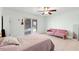 Cozy bedroom features a ceiling fan and sliding glass door to the patio at 4032 Cortez Dr # A, Tampa, FL 33614