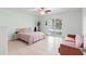 Bright bedroom featuring a ceiling fan and sliding glass door at 4032 Cortez Dr # A, Tampa, FL 33614