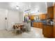 Cozy kitchen with eat-in table features stainless steel appliances, wooden cabinets, and tiled backsplash at 4032 Cortez Dr # A, Tampa, FL 33614