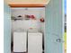 Convenient laundry closet includes a washer, dryer and shelving for storage of supplies at 4032 Cortez Dr # A, Tampa, FL 33614