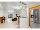 Bright living area with stainless steel refrigerator and an open floor plan at 4032 Cortez Dr # A, Tampa, FL 33614