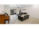 Comfortable living room features tile floors, cozy seating, and a sliding glass door for natural light at 4032 Cortez Dr # A, Tampa, FL 33614