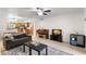 Comfortable living room with tile floors and a piano flows into an eat-in kitchen, creating an open space at 4032 Cortez Dr # A, Tampa, FL 33614