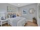 Cozy bedroom with natural light, complemented by stylish decor and inviting bedding at 4099 Pompano Se Dr, St Petersburg, FL 33705