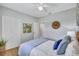 Comfortable bedroom with a ceiling fan and ample closet space for all your storage needs at 4099 Pompano Se Dr, St Petersburg, FL 33705