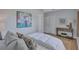 Inviting bedroom with a large floral artwork and closet space at 4099 Pompano Se Dr, St Petersburg, FL 33705