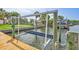 Boat lift on a private dock with power, showcasing waterfront living and ease of boating at 4099 Pompano Se Dr, St Petersburg, FL 33705