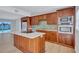 Elegant kitchen with stainless steel appliances, sleek countertops, and custom cabinetry, creating a gourmet experience at 4099 Pompano Se Dr, St Petersburg, FL 33705