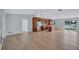 Bright open-concept kitchen with stainless steel appliances and a central island, flowing into the spacious living area at 4099 Pompano Se Dr, St Petersburg, FL 33705