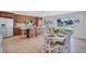 Spacious eat-in kitchen with modern island, seating, and stainless steel appliances at 4099 Pompano Se Dr, St Petersburg, FL 33705