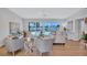 Bright living room featuring water views and access to the pool at 4099 Pompano Se Dr, St Petersburg, FL 33705