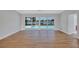 Spacious living room with large windows offering a serene view, enhancing the home's airy and bright atmosphere at 4099 Pompano Se Dr, St Petersburg, FL 33705