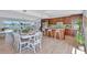 Bright, open-concept floor plan with modern kitchen and dining area overlooking water views at 4099 Pompano Se Dr, St Petersburg, FL 33705
