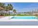 Relaxing pool area with views of mature landscaping and the tranquil bay, perfect for outdoor enjoyment at 4099 Pompano Se Dr, St Petersburg, FL 33705