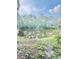 Scenic backyard pond surrounded by lush greenery and mature trees, creating a peaceful retreat at 4117 Muriel Pl, Tampa, FL 33614