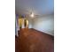 Spacious bedroom featuring a ceiling fan, tile flooring and doorway to the bathroom at 4117 Muriel Pl, Tampa, FL 33614