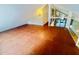 Large open-plan living room with tile floors and spiral staircase leading to upper level at 4117 Muriel Pl, Tampa, FL 33614