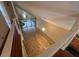 Bright open-plan living room with tiled flooring and spiral staircase leading to upper level at 4117 Muriel Pl, Tampa, FL 33614