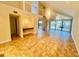 Bright living room featuring tile floors, wet bar, high ceilings, and sliding doors to patio at 4117 Muriel Pl, Tampa, FL 33614