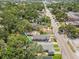 Aerial view showing the property near the street, trees, and the neighborhood at 419 W Osborne Ave, Tampa, FL 33603
