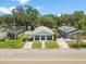 A lovely bungalow surrounded by lush greenery and neighboring properties at 419 W Osborne Ave, Tampa, FL 33603