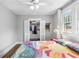 Bedroom with hardwood floors and closet featuring clothing at 419 W Osborne Ave, Tampa, FL 33603