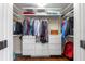 Walk-in closet with custom shelving, drawers, and ample hanging space at 419 W Osborne Ave, Tampa, FL 33603