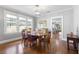 Elegant dining room with hardwood floors and an open floorplan with an adjacent living room at 419 W Osborne Ave, Tampa, FL 33603