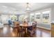 Elegant dining room with hardwood floors, chandelier, and an open floorplan at 419 W Osborne Ave, Tampa, FL 33603