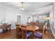 Elegant dining room with hardwood floors, chandelier, and seating for six at 419 W Osborne Ave, Tampa, FL 33603