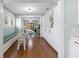 Dining area with window seating, views to living room and full-height kitchen cabinetry at 419 W Osborne Ave, Tampa, FL 33603