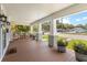 Spacious front porch with ample seating and decorative planters, ideal for enjoying the neighborhood view at 419 W Osborne Ave, Tampa, FL 33603