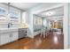 View of the kitchen, dining nook with cushioned bench seating, and living room at 419 W Osborne Ave, Tampa, FL 33603